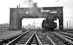03 091 vom Bw Rheine wartet unter dem markanten Reiterstellwerk "Hpn" im Bahnhof Hamm/Westf.  (17.04.1964) <i>Foto: Willi Marotz</i>