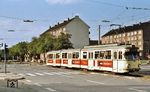 Straßenbahnzug 3109 der KVB kreuzt als Linie 5 auf der Subbelrather Straße fahrend in Richtung Friesenplatz/U-Bahn zum Dom/Hbf, die Innere Kanalstraße in Köln-Ehrenfeld. Der Triebwagen (urspr. Duewag, Baujahr 1965) war 1969 unter Verwendung eines Heckteils 4achsiger Beiwagen neu aufgebaut worden und erhielt eine Siematic-Steuerung. Gleichzeitig wurde er von Tw 3048 in Tw 3109 umgezeichnet. (03.10.1976) <i>Foto: Peter Schiffer</i>