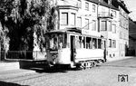 Die Koblenzer Straßenbahn wurde als Pferdebahn am 28.5.1887 eröffnet, 1899 elektrifiziert und konnte sich mit ihren ausschließlich kleinen 2-achsigen Triebwagen, die jüngsten hatten Baujahr 1914, noch bis zum 19.7.1967 halten. Betrieben wurde sie von der 1886 gegründeten und 2014 aufgelösten Koblenzer Elektrizitätswerk und Verkehrs-AG, kurz KEVAG. Tw 37 (Weyer/AEG, ex Serie 83-93, Baujahr 1903/04) ist in der Schützenstraße am Abzweig zum Betriebshof unterwegs. (04.07.1957) <i>Foto: Aad van Ooy</i>