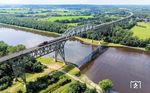 Auf der Hochdonner Brücke über den Nord-Ostsee-Kanal befördert 218 497 den IC 2375 von Westerland (Sylt) nach Hannover. Die Stahlfachwerkbrücke besitzt eine Gesamtlänge von 2.218 m und ist damit die viertlängste Eisenbahnbrücke in Deutschland. (19.07.2024) <i>Foto: Joachim Schmidt</i>