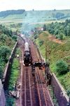 Blick vom Westportal des Rehbergtunnels auf die aus Altenbeken ausfahrende 044 209 vom Bw Ottbergen. (18.07.1970) <i>Foto: Herbert Vaupel</i>