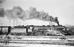 03 050 vom Bw Pasewalk vor einem Leerreisezug im Bahnhof Berlin-Lichtenberg, der aus der Abstellgruppe an den Bahnhsteig fährt. (03.01.1969) <i>Foto: Manfred Verhoolen</i>