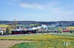 01 150 und 23 105 mit Sonderzug 1 (Dz 19142) zwischen Großenlüder und Bad Salzschlirf in Eichenau. (29.04.1990) <i>Foto: Joachim Bügel</i>