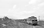 132 078 (Bw Nordhausen) vor der einstigen Nordhäuser 44er Leistung des Gipszuges in Erdeborn zwischen Sangerhausen und Halle/S auf der 1866 in Betrieb genommenen Halle-Casseler Eisenbahn. Die Windmühle aus dem Jahr 1850 existiert heute noch. (20.04.1987) <i>Foto: Thomas Fischer</i>