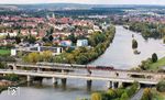 Am Vortag der Sonderfahrt überführte 01 1104 einige Wagen (Gbs, Hecht und zwei Silberlinge) als DLr von Würzburg nach Nürnberg. Beim Erscheinen auf der Mainbrücke in Kitzingen hatte sich allerdings die Sonne hinter den Wolken verabschiedet.  (11.10.2024) <i>Foto: Joachim Schmidt</i>