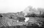 044 385 (Bw Gelsenkirchen-Bismarck) verlässt mit einem Kohlezug den Übergabebahnhof Oberhausen Hütte. Dieser hatte einst Anschluss an die Hüttenwerke der Gutehoffnungshütte und die Zechen Jacobi, Sterkrade, Hugo Haniel. Die Gleisanlagen sind heute verschwunden. (24.04.1975) <i>Foto: Joachim Schmidt</i>