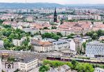 01 1104 fährt mit DPE 347 in den Bahnhof Dresden-Neustadt ein. Die Szene überragt der 81 m hohe Turm der Martin-Luther-Kirche aus den 1880er Jahren. (17.05.2025) <i>Foto: Joachim Schmidt</i>