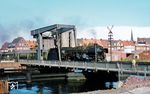012 066 rumpelt mit dem D 715 (Norddeich - München) über die Klappbrücke in Emden. (01.10.1974) <i>Foto: Robin Fell</i>