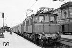 E 04 23 (Bw Magdeburg-Buckau) vor einem Personenzug in Magdeburg Hbf. (05.1967) <i>Foto: Robin Fell</i>