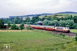 103 244	mit EC 79 "Helvetia" (Hamburg-Altona - Frankfurt/M - Basel SBB - Zürich HB) bei Hermannspiegel südlich von Bad Hersfeld. (01.06.1990) <i>Foto: Wolfgang Bügel</i>