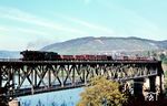 Die Ehranger 044 737 (ex 44 1737) mit einem Güterzug nach Ehrang auf der Bullayer Moselbrücke. (08.1970) <i>Foto: Robin Fell</i>