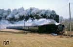 001 180 ballert mit dem D 853 nach Hof bei Marktschorgast vorbei. Am Schluss führt der Zug die DR-Kurswagen nach Görlitz mit, die in Hof auf den D 498 übergehen. (03.1973) <i>Foto: Robin Fell</i>