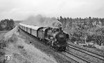 Nach einem Regenschauer räuchert 038 772 mit P 3969 nach Horb am Einfahrvorsignal von Bondorf (b Herrenberg) vorbei. (26.08.1971) <i>Foto: Burkhard Wollny</i>