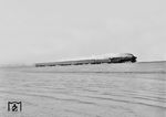 Für das Foto der 012 084 vor E 1776 auf dem Hindenburgdamm östlich von Morsum gab es wohl nasse Füße. (06.04.1969) <i>Foto: Jörg Schulze</i>