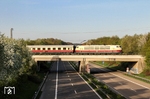 103 235 überquert vor IC 2417 (Flensburg - Köln) die Autobahn BAB 542 bei Langenfeld. (10.04.2011) <i>Foto: Joachim Bügel</i>