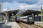 DSB MF 5080 fährt als EC 395 (København H - Hamburg Hbf) durch den Bahnhof Rendsburg und überholt dabei 648 342 der Nordbahn, der als RE 74 auf die Abfahrt nach Kiel wartet. (18.07.2024) <i>Foto: Thorsten Eichhorn</i>