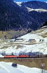 ÖBB 1044.087 und 1020.008 (ex E 94 034) vor Dg 44855 auf der Fahrt zum Brenner bei St. Jodok. (22.02.1988) <i>Foto: Joachim Bügel</i>