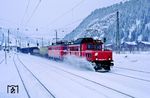 ÖBB 1020.004 (ex E 94 029) fährt mit 1110.004 vor Dg 57945 nach Saalfelden durch den Bahnhof Hochfilzen. (24.02.1988) <i>Foto: Joachim Bügel</i>