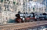 38 1910 vom Bw Düsseldorf Abstellbf befördert den E 4732 (Iserlohn - Düsseldorf Hbf) an der bekannten Felswand in Ennepetal. (08.1962) <i>Foto: Rolf Hahmann</i>