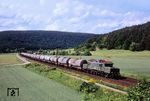 194 158 der Rail 4U Willich mit einem Kesselwagen-Ganzzug zwischen Wernfeld und Karlstadt bei Harrbach. (05.08.2014) <i>Foto: Dieter Kempf</i>