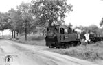 Am letzten Betriebstag war sogar noch ein Rollwagen-Güterzug mit 99 4701 unterwegs, aufgenommen bei Havelberg. (31.05.1969) <i>Foto: Helmut Pochadt</i>