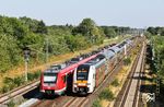 Bei Langenfeld-Mehlbruch begegnen sich RRX 462 007 als RE 26810 nach Köln und 422 080 als S 30651 nach Essen Hbf. In der Ferne entschwindet 402 017 als ICE 2834 (Köln Hbf - Emden Außenhafen), ein Ersatzzug für den ausgefallenen IC 2204. (15.07.2026) <i>Foto: Joachim Bügel</i>