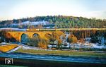 Eine 103 führt den IC 694 "Kieler Förde" (München - Stuttgart - Frankfurt/M - Hannover - Hamburg-Altona - Kiel) auf dem Viadukt über die Sontra zwischen Cornberg und Sontra. (24.02.1991) <i>Foto: Wolfgang Bügel</i>