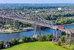 RJ 13462 (Hamburg Hbf - København) auf der Rendsburger Hochbrücke über den Nord-Ostsee-Kanal mit EB 3238 (Zugspitze) und EB 3238 am Zugschluss. Erstellt wurde die Brücke von rund 350 Arbeitern in zwei Jahren. Zusammengefügt wurden 17.740 Tonnen Stahl mit 3,2 Millionen Nieten. Die Brücke war damit die schwerste Stahlkonstruktion der Welt. Für den Eiffelturm wurden lediglich 7.300 Tonnen Stahl verbaut. Der Bau kostete damals 13,4 Millionen Goldmark, was nach heutiger Währung inflationsbereinigt etwa 90,1 Millionen Euro entspräche. (21.07.2026) <i>Foto: Joachim Schmidt</i>