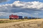 243 201 der Wedler Franz Logistik Potsdam mit einem DGS von Guben nach Oberhausen vor dramatischer Wolkenkulisse bei Delitzsch. (21.07.2026) <i>Foto: Ralf Opalka</i>