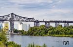 Vor dem nur freitags verkehrenden DGS 52568 nach Wanne-Eickel passieren 181 215 und 181 204 der SEL den Nord-Ostsee-Kanal auf der Rendsburger Hochbrücke. (31.07.2026) <i>Foto: Thorsten Eichhorn</i>