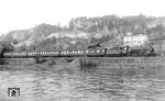 18 614 vom Bw Ulm mit dem D 235 (Innsbruck - Frankfurt/M) in Ulm-Donautal. Der Zug führte bis Lindau Schlaf- und Liegewagen der ÖBB aus Wien Westbf. Ab Lindau bestand der Zug nur noch aus drei Wagen, von denen einer in Ulm auf den D 503 nach Hagen überging. (19.03.1960) <i>Foto: Carl Bellingrodt</i>