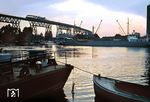 Die 1920 fertiggestellte Brücke über den Nord-Ostsee-Kanal bei Hochdonn ist auch heute noch eine der beliebtesten Fotomotive der Marschbahn. Im Sommer 1968 fährt eine 01.10 mit dem D 134 in der Abenddämmerung über die Hochbrücke. (09.1968) <i>Foto: Jürgen Hagemann</i>