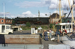 012 077-4 (01 1077) passiert mit einem Schnellzug nach Westerland den Husumer Fischereihafen. (24.08.1972) <i>Foto: Johannes Peisker</i>