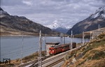 Der höchste Punkt auf der Berninabahn (St. Moritz - Tirano) ist die Station Ospizio Bernina mit 2253 m ü.M. Extrazug 3911 mit der Rhb ABe 4/4 Nr. 35 wartet hier eine Zugkreuzung ab. (15.10.1988) <i>Foto: Ulrich Neumann</i>