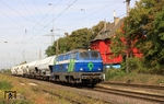 Hinter der NIAG Lok 9 verbirgt sich die ehemalige DB 216 111, die mit ihrem Zug das ehemalige Empfangsgebäude von Lintorf auf der Güterzugstrecke von Duisburg-Wedau nach Gremberg passiert. (02.10.2013) <i>Foto: Wolfgang Bügel</i>