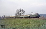 Nanu - ist doch gar keine Dampflok !  Die Eisenbahnfreunde Hannover verabschiedeten sich "standesgemäß" mit 104 019, die den Sonderzug E 26189 von Rheine zurück nach Hannover brachte. Die Aufnahme entstand bei Melle zwischen Osnabrück und Bünde. (13.03.1977) <i>Foto: Wolfgang Bügel</i>