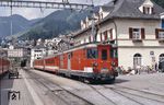 Im Bahnhofsteil Disentis der Furka-Oberalp-Bahn fährt Deh 4/4 55 mit Regionalzug 229 ein. (29.06.1993) <i>Foto: Ulrich Neumann</i>