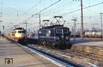 103 165 hat im Bahnhof Emmerich den TEE 17 "Erasmus" (Den Haag - München) von der NS-Lok 1106 übernommen. (06.12.1978) <i>Foto: Peter Schiffer</i>