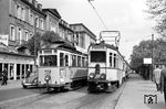 In Heidelberg begegnen sich Tw 36 der Straßenbahn Heidelberg und der Halbzug Tw 44 aus dem Jahr 1928 der Oberrheinischen Eisenbahn-Gesellschaft. (26.05.1962) <i>Foto: Helmut Röth *</i>