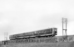 VT 137 290 a/b der Bauart "Ruhr" auf Abnahmefahrt bei Wuppertal-Langerfeld. Es war die erste VT-Bauart, die in dem vorgesehenen neuen Triebwagenanstrich ganz in "rot" geliefert wurde. (08.03.1938) <i>Foto: RVM-Filmstelle Berlin (Bellingrodt)</i>