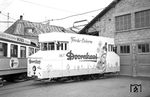 "Frohe Ostern" mit dem Reklamewagen (ex Tw 100) im Depot Leimen. Obwohl die Alkoholwerbung in Deutschland (noch) nicht verboten wurde, wäre so ein Fahrzeug heutzutage in den Straßen kaum denkbar. (22.03.1964) <i>Foto: Helmut Röth *</i>