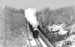 01 1091 mit E 533 (Aachen - Braunschweig) auf der Fahrt durch den winterlichen Martfelder Einschnitt in Schwelm. (1956) <i>Foto: Carl Bellingrodt</i>