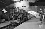 23 090 (Bw Krefeld) hat in Köln Hbf einen Schnellzug nach Nijmegen/NL übernommen. (1959) <i>Foto: M.C. Mugridge</i>