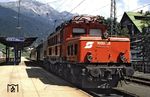 ÖBB 1020.28 (ex E 94 064, AEG, Baujahr 1942) mit einem Personenzug in St. Anton am Arlberg. (08.1988) <i>Foto: David Smith</i>