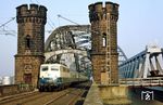 110 402 (Bw Dortmund 1) mit D 2940 (Walkenried - Northeim - Altenbeken - Hamm - Essen - Düsseldorf - Aachen) auf der alten Rheinbrücke zwischen Düsseldorf und Neuss. (06.03.1987) <i>Foto: Wolfgang Bügel</i>