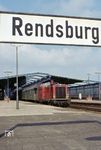 211 014 (Bw Flensburg) mit einem Personenzug im Bahnhof Rendsburg. (09.04.1972) <i>Foto: Dieter Junker</i>