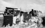 Nach schweren Schneestürmen in der Nacht vom 12. zum 13. Januar 1963 fuhr sich bei Leimstruth der Ng 9121 mit einer V 100 fest. Auch die 1000 PS der Erndtebrücker 93 1074 reichten nicht aus, um die Schneemassen zu überwinden. Lokführer Gerhard Moll vermerkte dazu: "Lok war auf der anderen Seite bis Oberkante Wasserkasten im Schnee. Draußen 29° minus - Lok noch im Feuer. 2 Ohren und eine Verse erfroren, 25,- DM Belohnung erhalten, Lok gerettet."  (13.01.1963) <i>Foto: Gerhard Moll</i>