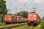 Während der Beseitigung der Bremsstörung am GAG 60715 überholte 185 303 mit dem GAG 68601 (Mülheim-Speldorf - Mannheim Rbf) den Zug im stark verwilderten Bahnhof Immigrath. (20.07.2021) <i>Foto: Joachim Bügel</i>