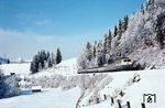 Ein sonniger Märztag überraschte über Nacht mit viel Neuschnee, der für wundervolle Fotos sorgte. 111 003 mit einem Eilzug nach München kurz vor Garmisch-Partenkirchen. (25.03.1979) <i>Foto: Karsten Risch</i>