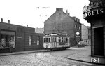 Tw 517 (ex Ruhrort) auf der Linie 11 nach Marxloh Pollmann in der Friedrich-Engels-Straße in Duisburg-Hamborn, die noch stark vom Nachkriegszustand geprägt ist. (20.09.1959) <i>Foto: Aad van Ooy</i>